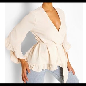 Ruffle hem wrap blouse